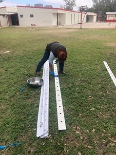 Man assembling hydroponics system